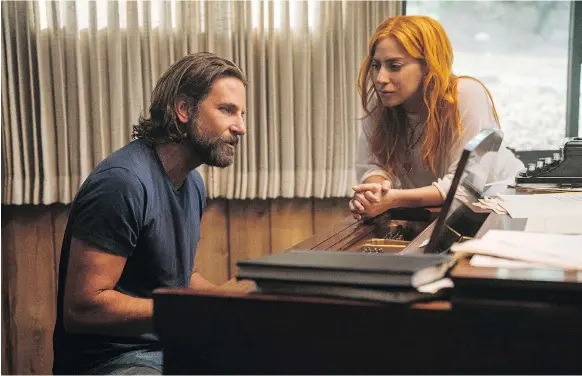  ?? PHOTOS: WARNER BROS. ?? A Star Is Born actor-director Bradley Cooper, seen with co-star Lady Gaga, says he was interested in telling a love story through song in the latest version of the movie.