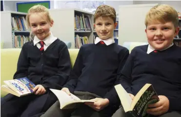  ?? Picture: Gemma Davidson ?? Pupils Sophie Baker, Benji Stickley and Logan Tull enjoy their new library.