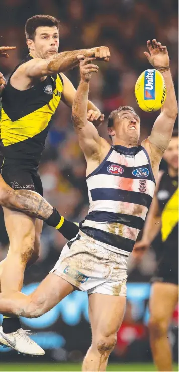  ?? Picture: SCOTT BARBOUR ?? TOUGH CONTEST: Trent Cotchin spoils Joel Selwood at the MCG last night.