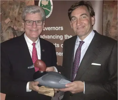  ?? (Submitted photo) ?? Governor Phil Bryant, left, receives the GSC Heritage Award from CSF Board Member and Theodore Roosevelt’s great-grandson, Simon Roosevelt. Bryant and Roosevelt recently celebrated an re-enactment of President Roosevelt’s 1902 bear hunt.