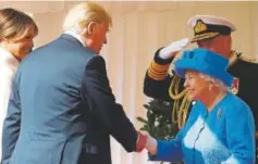  ?? Chris Jackson, AFP ?? President Donald Trump shakes hands with Queen Elizabeth II as Trump and first lady Melania arrive Friday at Windsor Castle.