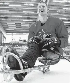  ?? CP PHOTO ?? Dominic Larocque of Quebec City, a former soldier who lost his leg in Afghanista­n and who now plays for the Canadian sledge hockey team, practises with teammates in Calgary.