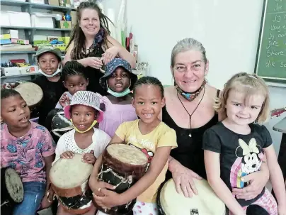  ?? ?? MAKE SOME NOISE: PAHS Pre-primary Grade R Lions class enjoy a drumming lesson with Cornelia Beer and Bev Brunette