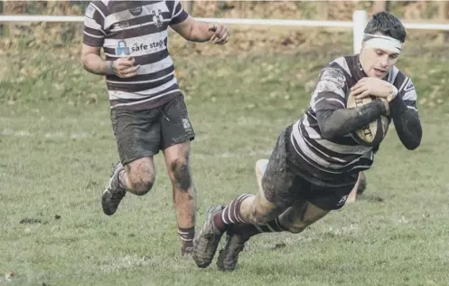  ??  ?? TAKING A DIVE: Jacob Bower scores for Old Rishworthi­ans in their Yorkshire Two win over Ripon
Picture: Jade Smith