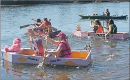  ?? ELYSE WHITMAN PHOTO ?? The Cardboard Boat Race at Bridgetown’s annual Ciderfest celebratio­n always results in smiles and hard rowing by young and old.