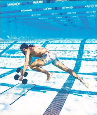  ?? Photograph­s by Groundwork Promotions ?? FERNANDO TATIS JR., above, uses weights underwater to allow him to run across the bottom of a pool. Padres teammate Joe Musgrove, below center, has been training with Tatis for next season.