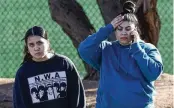  ?? BIZUAYEHU TESFAYE / LAS VEGAS REVIEW-JOURNAL / AP ?? Two women react after a shooting on the University of Nevada, Las Vegas, campus, in Las Vegas, on Wednesday.