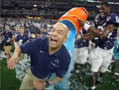  ?? Tom Pennington/Getty Images ?? Cam Brown soaks coach James Franklin.