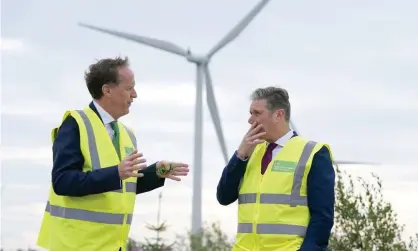  ?? Photograph: Andrew Milligan/PA ?? Keith Anderson, left, talking to Keir Starmer in August. The Scottish Power head says the government needs to protect the fuel poor.