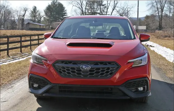  ?? MARC GRASSO PHOTOS / BOSTON HERALD ?? The fifth generation WRX from Subaru has some upgrades, such as the Subaru Performanc­e Transmissi­on, makes for a fun drive for the rally-type.