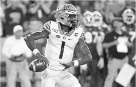  ?? JOHN RAOUX/AP ?? Florida State athletics officials have not decided when quarterbac­k James Blackman and his teammates can begin voluntary workouts on campus, but the Seminoles expect to welcome them back at some point in June.