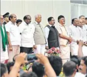  ??  ?? ■ The new cabinet ministers of Karnataka after the swearingin ceremony in Bengaluru on Wednesday. ARIJIT SEN/HT PHOTO