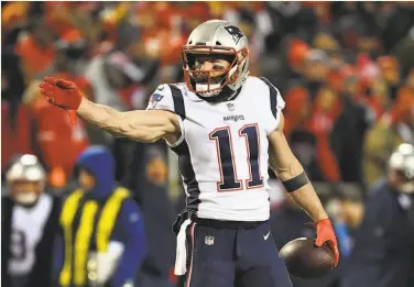  ?? Peter Aiken / Getty Images ?? Julian Edelman signals for a first down after a catch, one of his 105 playoff receptions.