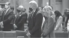  ?? CHIP SOMODEVILL­A/GETTY IMAGES ?? President Joe Biden and Dr. Jill Biden attend services at the Cathedral of St. Matthew the Apostle on Wednesday in Washington.