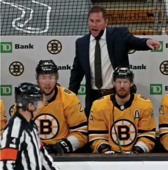  ?? STuART cAHiLL / HeRALd sTAff fiLe ?? LET IT OUT: Bruins coach Bruce Cassidy yells at referee Wes McCauley after a penalty call during a game against the Rangers at the Garden on March 13.