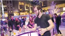  ??  ?? An energetic mixologist works his magic with cider at the annual Mondial des cidres SAQ at Complexe Desjardins.