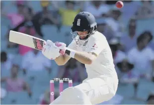  ??  ?? 2 England captain Joe Root avoids a bouncer as he battles to help his team avoid an innings defeat in Sydney.