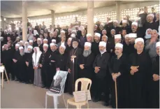  ?? Sana ?? In Deraa, southern Syria, members of Syria’s Druze community anxiously await news of the hostages taken by ISIS