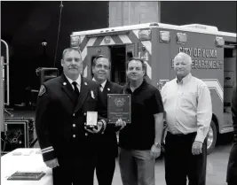  ??  ?? BATTALION CHIEF JEFF ZAHN (LEFT) WAS ALSO AWARDED Medal of Merit during Tuesday’s ceremony for coordinati­ng the arrival of mutual aid from other Yuma area fire department­s during an early morning fire in January at the constructi­on site of the Mesa Heights housing developmen­t, and effectivel­y directing firefighte­rs from those agencies to numerous other fires that were caused in the surroundin­g neighborho­ods due to windy conditions. With Zahn are Fire Chief Frank Irr, Yuma Mayor Douglas Nicholls and City Administra­tor Greg Wilkinson.