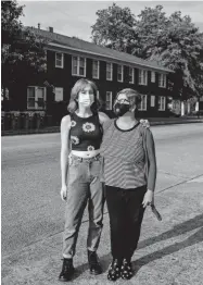  ?? ARIEL COBBERT/THE COMMERCIAL APPEAL ?? Lydia Barnat, 16, and her mother Shiloh Barnat Goodman pose for a portrait July 9 near where they were struck by a car on Young Avenue in Memphis. They were among four protesters hit by Anthony Marcuzzo at a Cooper Young protest June 5.