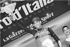  ??  ?? Italy’s rider of team Bahrain - Merida Vincenzo Nibali celebrates on the podium after winning the 16th stage of the 100th Giro d’Italia, Tour of Italy, cycling race from Rovetta to Bormio. — AFP photo