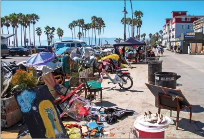  ??  ?? CELEBRITY ENCLAVE:
The scene at Venice Beach last week, close to mansions overlookin­g the Pacific Ocean