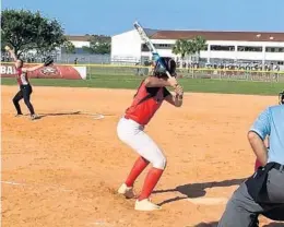  ?? WELLS DUSENBURY/STAFF PHOTO ?? Douglas starter Gianna Lovito winds up to deliver a pitch against Monarch in a Region 3-9A semifinal on Tuesday in Parkland.