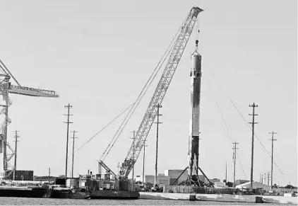  ?? RED HUBER/STAFF FILE PHOTO ?? The first stage of a SpaceX Falcon 9 rocket stands on land at Port Canaveral. “Space” is a relatively new category on the port’s cargo chart.