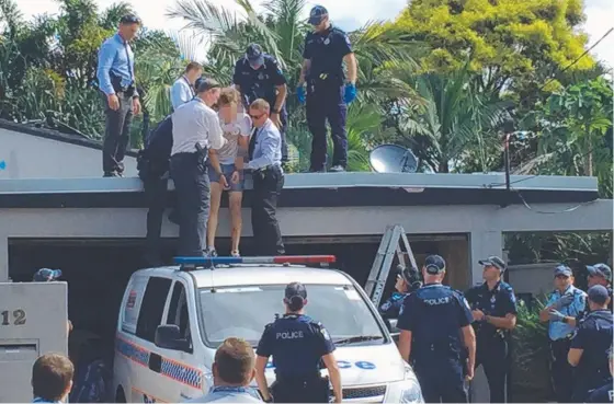  ??  ?? Police arrest Ryan John Howes for the alleged murder of Gold Coast teen Michael Brack – he was found in the roof of his grandparen­ts’ home.