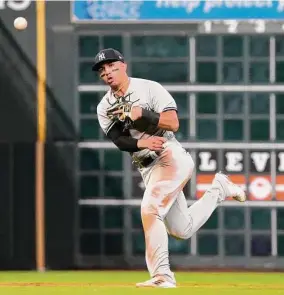  ?? Karen Warren/Houston Chronicle ?? New York Yankees shortstop Oswald Peraza throws out a Houston Astros batter in the seventh inning during Game 2 of the American League Championsh­ip Series at Minute Maid Park on Oct. 20 in Houston.