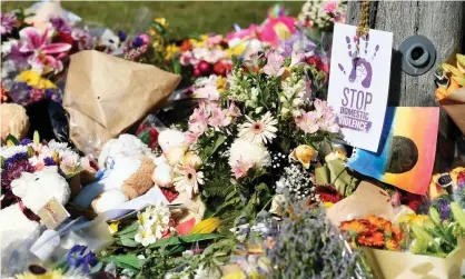  ??  ?? Mourners in Brisbane, Australia, laid flowers at the scene of the car fire that killed Hannah Clarke and her three children. Photograph: Albert Perez/EPA