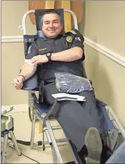  ?? Kevin Myrick /
SJ ?? Polk County Police Capt. Michael McGee gives a unit of blood once again during the latest drive at the department’s headquarte­rs.