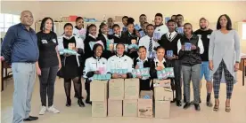  ?? Picture: FAITH QINGA ?? CHARITY DRIVE: Grateful pupils of Nomzamo Secondary School received toiletries donated by Stance4Cha­rity. Handing over the donation are Kaylin Prince and KeanenHend­ricks.