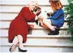  ?? Reuters ?? Barbara Bush pets her dog Millie as her grandaught­er looks on at the White House steps in this undated photo.