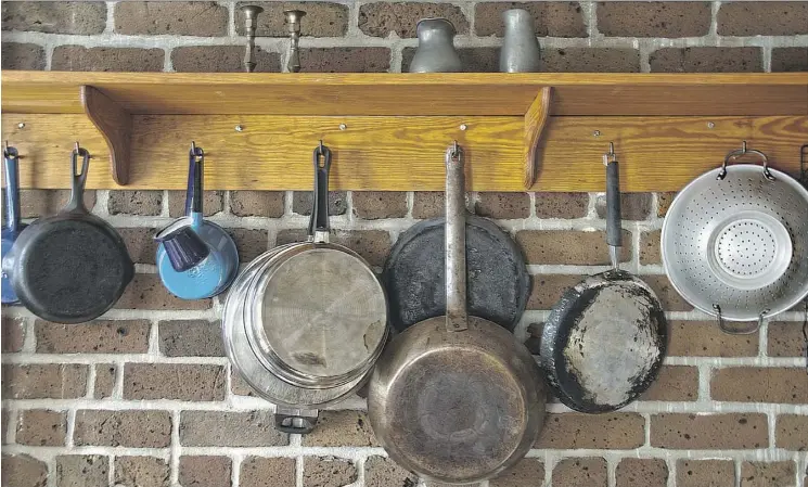  ??  ?? Assess how the things you use most in your kitchen are stored. Are they accessible? You can group like items, such as saucepans and cookware, to make their storage practical and attractive.