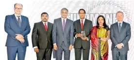  ??  ?? From left: Euromoney Editor Clive Horwood, NDBIB AVP Viraj Wijesinghe, NDBIB Director Vajira Kulatilaka, NDBIB CEO Darshan Perera, NDBIB Assistant Manager Azara Hameen and Euromoney Asia Editor Chris Wright