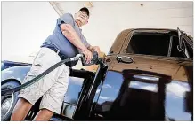  ?? MARSHALL GORBY / STAFF ?? Ed Whittaker stopped by Sam’s Club on Miller Lane to fill up his 1954 Chevy truck Tuesday.