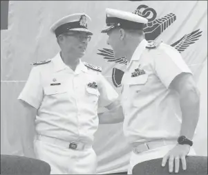  ?? CP PHOTO ?? Royal Canadian Navy Vice-Admiral Mark Norman, left, speaks with Vice-Admiral Ron Lloyd during a change of command ceremony in Ottawa on June 23, 2016. The RCMP has charged Vice-Admiral Mark Norman with one count of breach of trust.