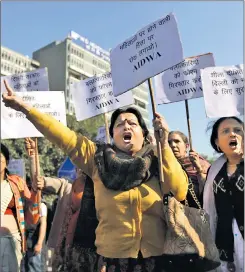  ?? AP ?? Women protest about the rape and murder of a medical student on a bus in Delhi