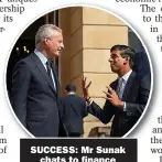  ??  ?? SUCCESS: Mr Sunak chats to finance chief about plan