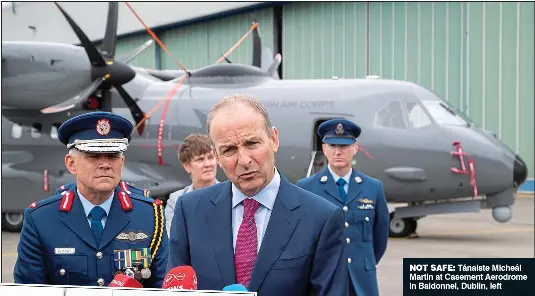  ?? ?? NOT SAFE: Tánaiste Micheál Martin at Casement Aerodrome in Baldonnel, Dublin, left