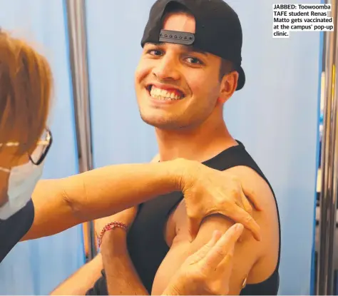  ?? ?? JABBED: Toowoomba TAFE student Renas Matto gets vaccinated at the campus' pop-up clinic.