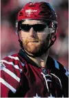  ?? ROB CARR/GETTY IMAGES ?? Karl Alzner of the Washington Capitals wears sunglasses during Thursday’s Winter Classic at Nationals Park. The Capitals beat the Chicago Blackhawks 3-2.