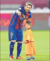  ?? AFP/FILE ?? Barcelona footballer Lionel Messi talks to Afghan boy Murtaza Ahmadi in Doha on December 13, 2016.