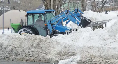  ?? DAVID JALA/CAPE BRETON POST PHOTOS ?? Snow removal crews were still out in force on Wednesday, 24 hours after a nor’easter deposited more than 70 cm of snow in Cape Breton from Monday afternoon through Tuesday morning. In the above picture, an equipment operator clears the sidewalk...