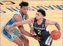  ?? FRANK FRANKLIN II/AP PHOTO ?? UConn sophomore James Bouknight, right, announced Wednesday he is leaving the Huskies after two seasons to enter the NBA Draft.