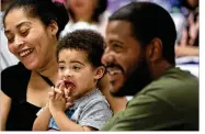  ??  ?? Armani Fountain, 2, and his parents Chastity WrightFoun­tain and Rovel Fountain gather for the annual baby shower for local moms at the Sinai Community Institute in Chicago in June.