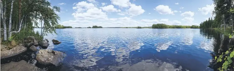  ??  ?? A summertime view of Lake Rutajarvi, in Finland, a country with an understate­d, quiet charm, where silence and calmness are still valued.