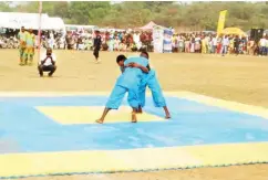  ??  ?? Wrestling match between two contestant­s during the festival.