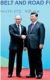  ??  ?? President Xi Jinping (R) shakes hands with Russia's President Vladimir Putin during the Belt and Road Forum in Beijing yesterday.